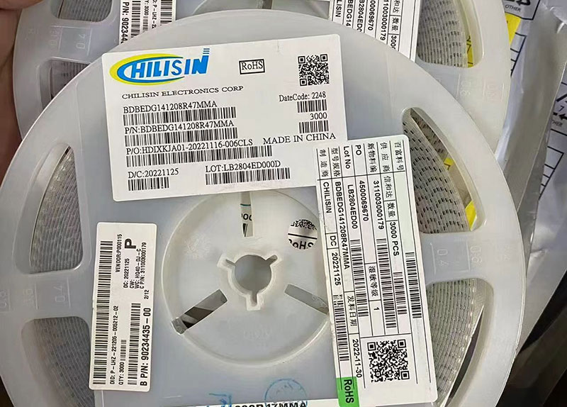 Factory original reels of Chilisin Electronics inductors (P/N: BDBEDG141208R47MMA) with clear labels showing lot numbers.