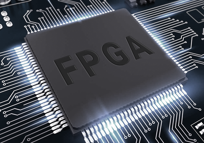 A high-reliability Field Programmable Gate Array (FPGA) semiconductor chip mounted on a dark multi-layer printed circuit board with high-speed digital silver routing traces.